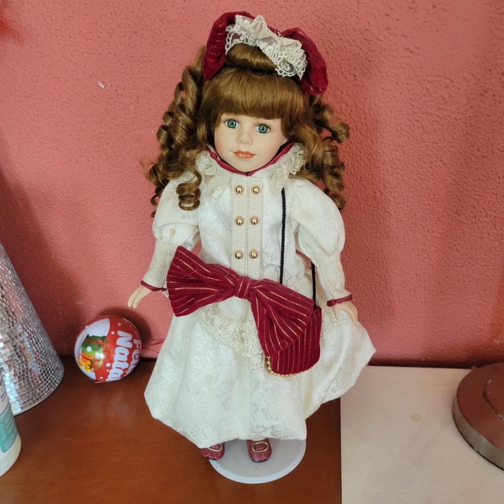 Ceramic doll fully dressed see photos